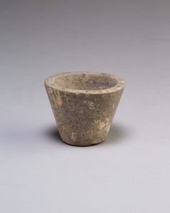Small dark stone Egyptian vessel from the tomb of Perneb used in the Opening of the Mouth funerary ritual.